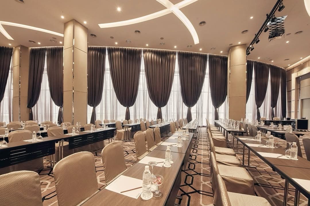 An auditorium with orange seats