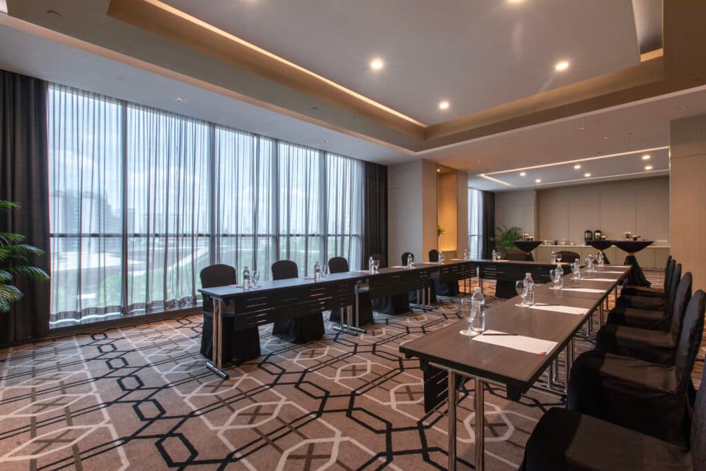 A small conference room with floor-to-ceiling windows